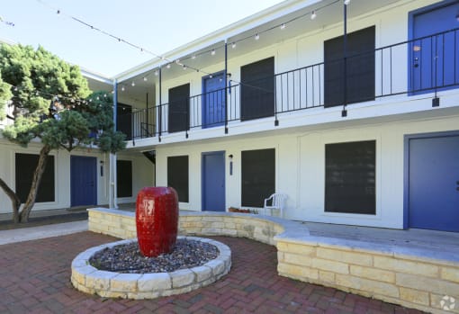 Soco at Alpine Outdoor Common area with fountain and Exterior building