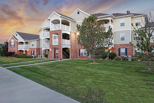 A large apartment complex with multiple buildings and balconies.