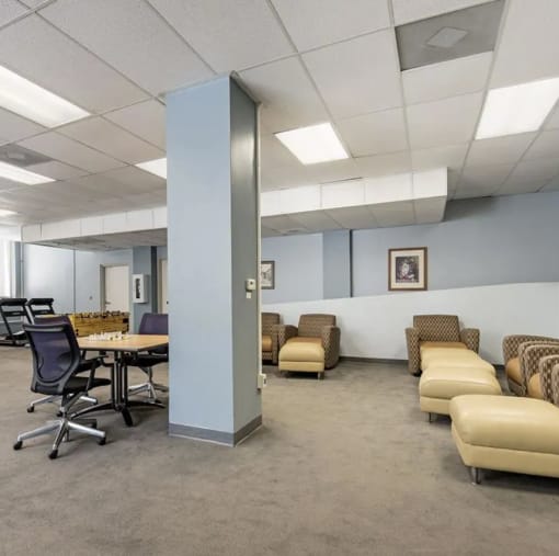 a room with a table and chairs in it