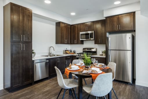 YOLO East dining table and kitchen with appliances