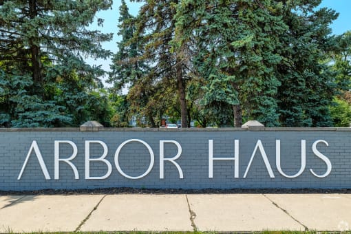 a brick wall with the words arbor haus written on it