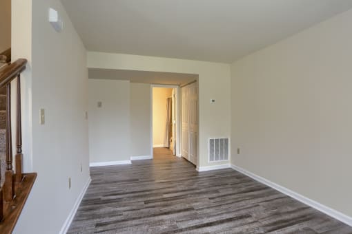 Mechanicsburg Apartments | Rockledge Townhomes |a bedroom with hardwood floors and white walls