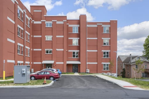 Mount Joy Senior Housing | a large red building with a parking lot in front of it