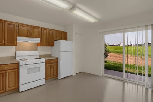 a kitchen with white appliances and wooden cabinets and a large window
