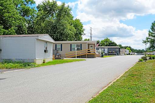 A residential street with houses on both sides.