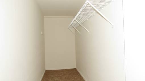 A white wall with a white ceiling and a white floor.
