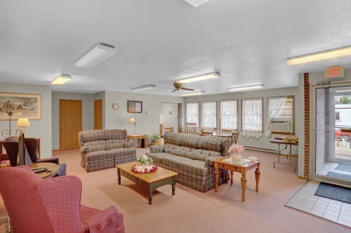 a living room with couches and chairs