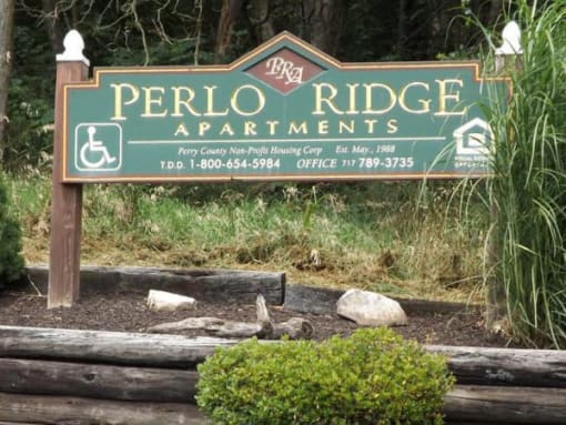 a sign for the perillo ridge apartments