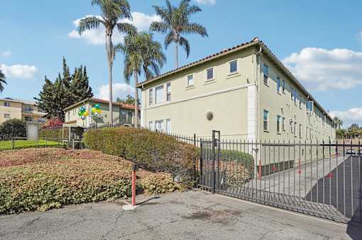 A building with a black gate in front of it.