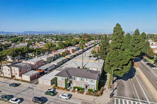 A residential area with houses and parked cars.
