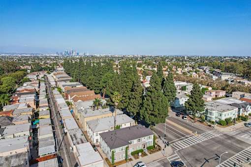 A view of a residential area with houses and trees.