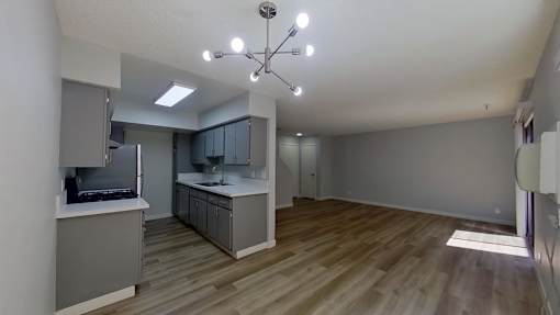 Living room with wooden flooring and light fixtures