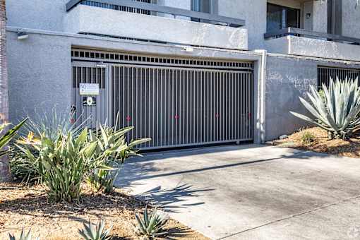 a garage door in front of an apartment building