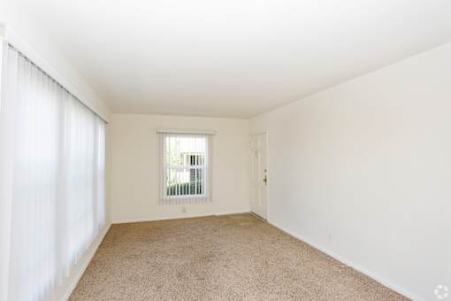 A room with a window and a door.