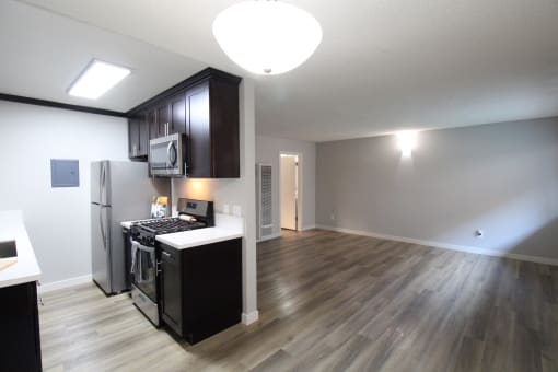 a view of a kitchen and a living room from above