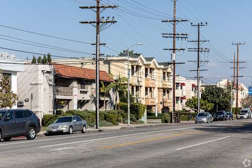 A street scene with cars and buildings.