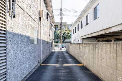 A narrow alley with a yellow line down the middle.