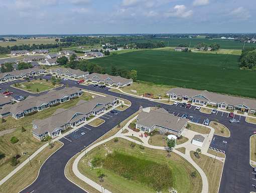 A bird's eye view of a residential area with houses and roads.