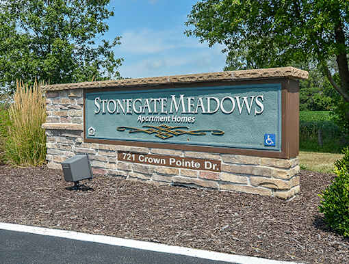 Stone gate meadows apartment homes sign.