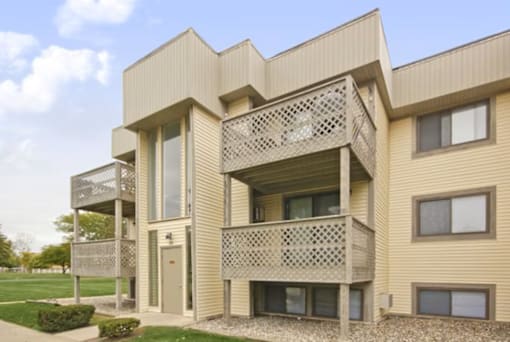 A modern building with a balcony and a window.
