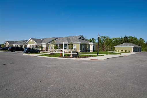 A parking lot with a building in the background.