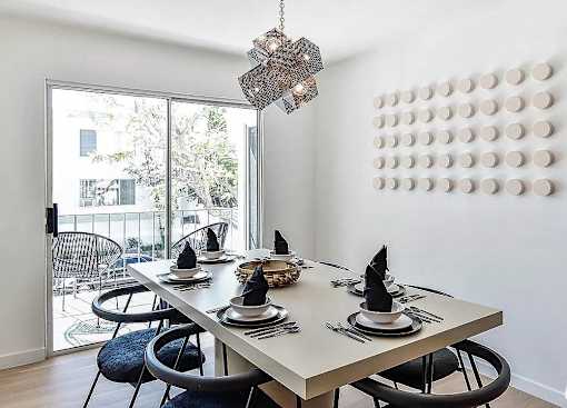 a dining room with a table and chairs at 8535 Colgate-Fully Furnished Apartments, Los Angeles, 90048