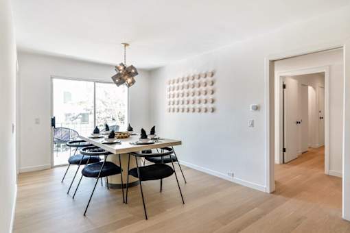 a dining room with a table and chairs at 8535 Colgate-Fully Furnished Apartments, Los Angeles, 90048