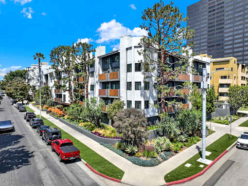 A street view of a residential area with cars parked on the side of the road at Westwood Riviera Apartments, Los Angeles