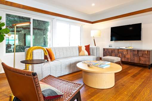 a living room with a couch and a table at 8535 Colgate-Fully Furnished Apartments, Los Angeles, CA