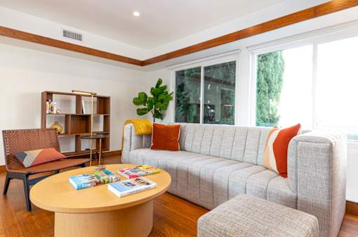 a living room with a couch and a table at 8535 Colgate-Fully Furnished Apartments, California