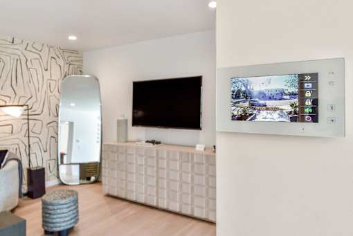 a living room with a television on the wall at 8535 Colgate-Fully Furnished Apartments, California, 90048