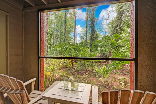 a room with a table and chairs and a large window at Timberwalk at Mandarin Apartment Homes, Florida, 32257