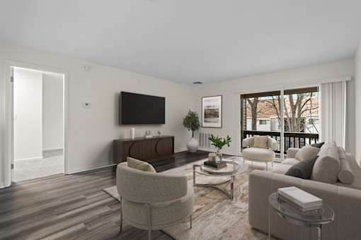 Living room with wood flooring and balcony at The Northway at Clifton Park Apartments, Clifton Park, NY 12065