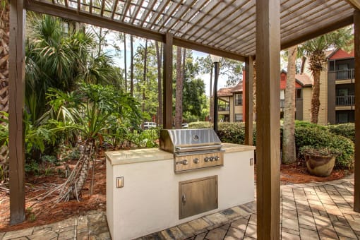 a covered patio with a gas grill at Timberwalk at Mandarin Apartment Homes, Florida, 32257