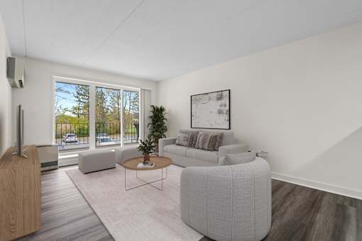 A living room with a grey sofa and a coffee table.