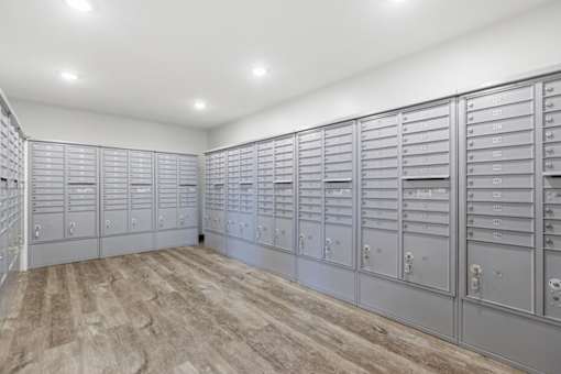A room with a row of mailboxes on the wall.
