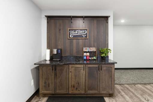 A wooden bar with a sign that says