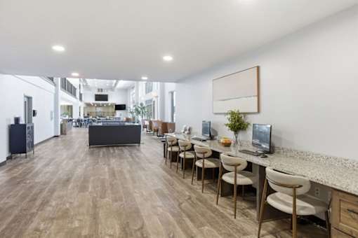 A long table with chairs is in the middle of a room.