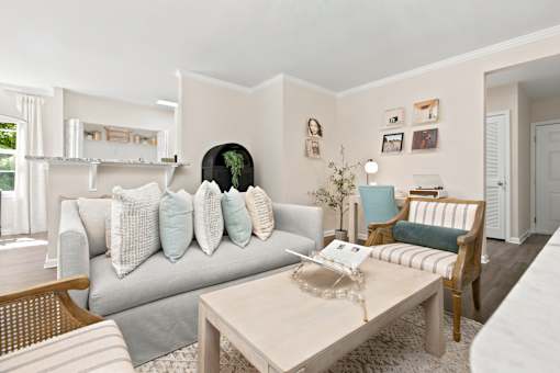 A living room with a grey couch and a coffee table.