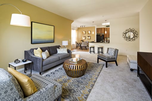 a living room with a couch and a table at Merion Stratford Apartment Homes, Stratford