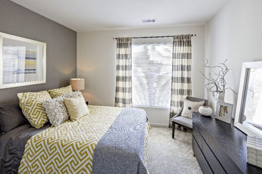 a bedroom with a bed and a window at Merion Stratford Apartment Homes, Stratford, CT
