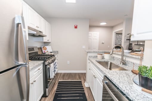 an overhead view of a kitchen with stainless steel appliances at Merion Milford Apartment Homes, Milford, 06460