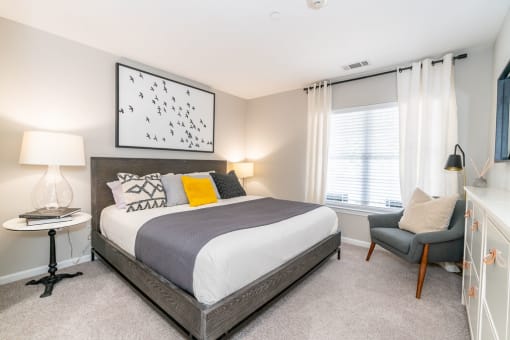 a bedroom with a bed and a window at Merion Milford Apartment Homes, Milford, CT 06460