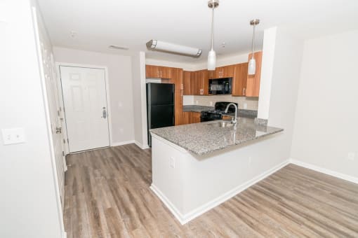 Contemporary Finishes Include Wood And Tile Flooring at Merion Stratford Apartment Homes, Stratford, CT