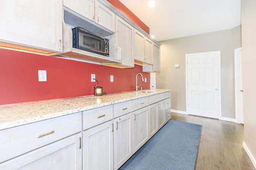 A kitchen with white cabinets at North Pointe Apartments, Clifton Park, NY, 12065