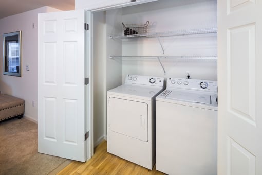 a washer and dryer in a room with a closetat Merion Stratford Apartment Homes, Connecticut