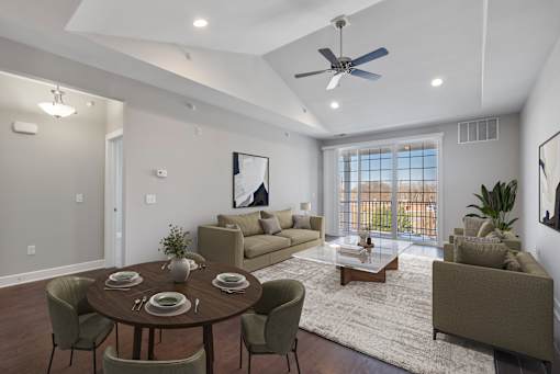 A modern dining room with a round table set for six.
