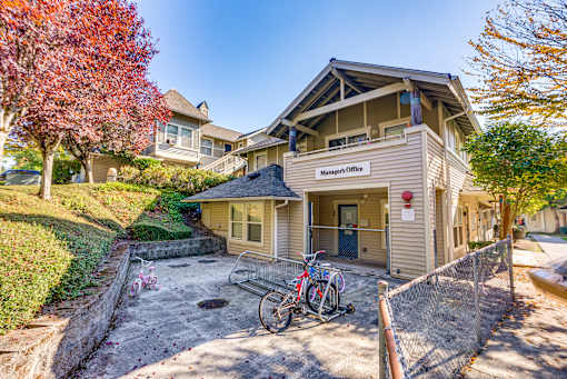 A house with a sign that says "Manager's Office" on the front.