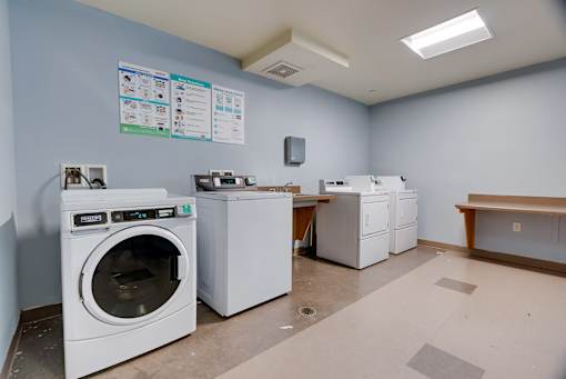 A laundry room with a washer and dryer.