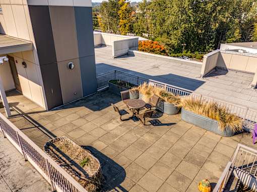 A patio area with a table and chairs.